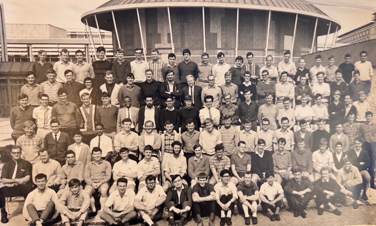 A vintage photo of students in front of the old Engineering 'Mushroom' building
