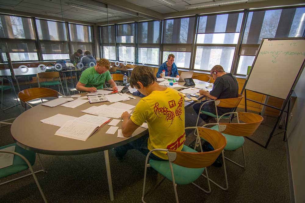 UC students studying in the Engineering and Physical Sciences Library.